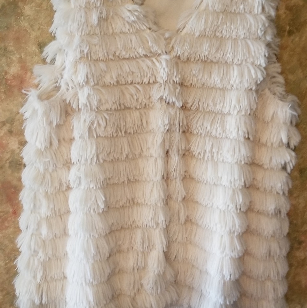 Vest with one button closure.